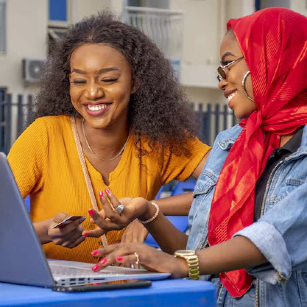 closeup-shot-two-cheerful-young-african-ladies-laptop_181624-43845 closeup-shot-two-cheerful-young-african-ladies-laptop_181624-43845