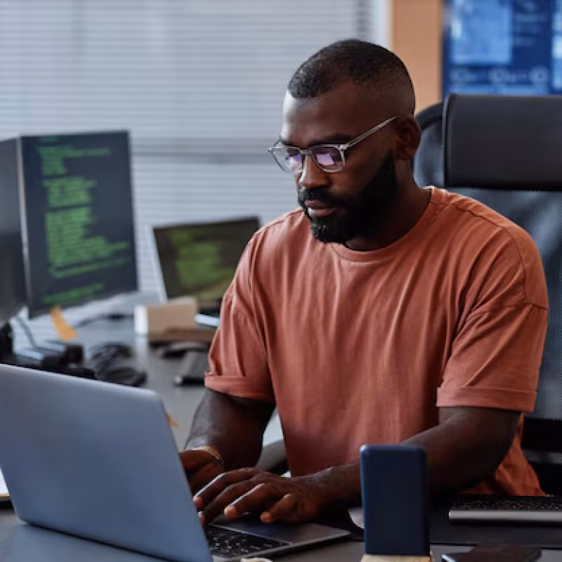 portrait-black-software-engineer-using-computer-high-technology-office-data-systems-progra_236854-44710