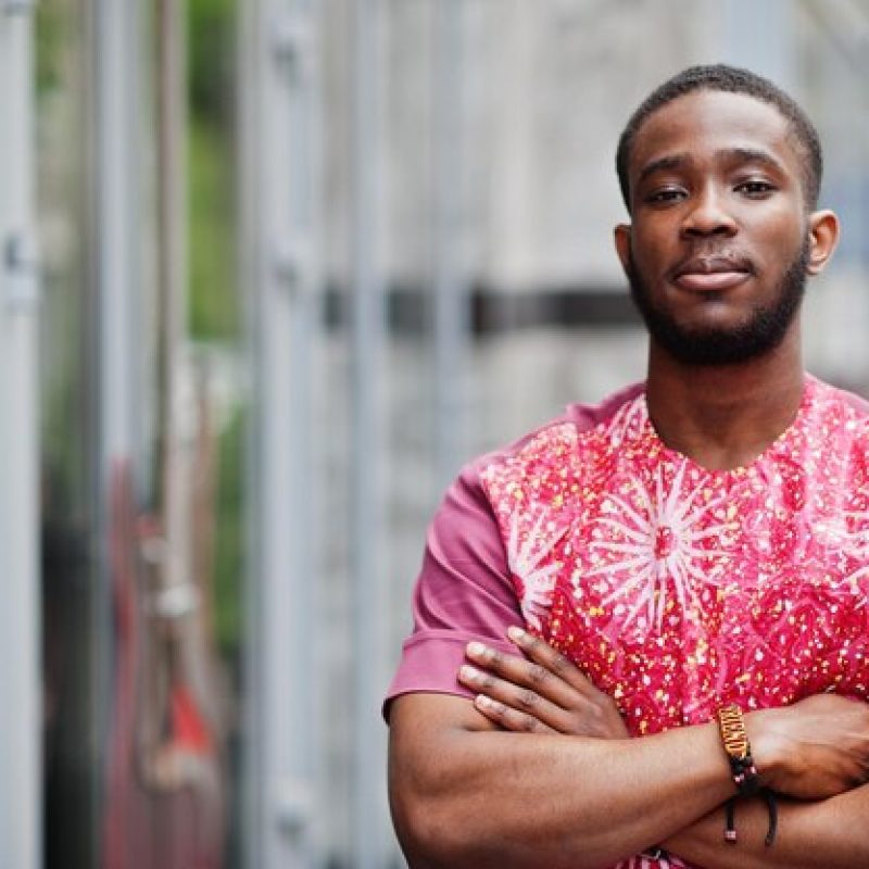 portrait-black-young-man-wearing-african-traditional-red-colorful-clothes_627829-4909