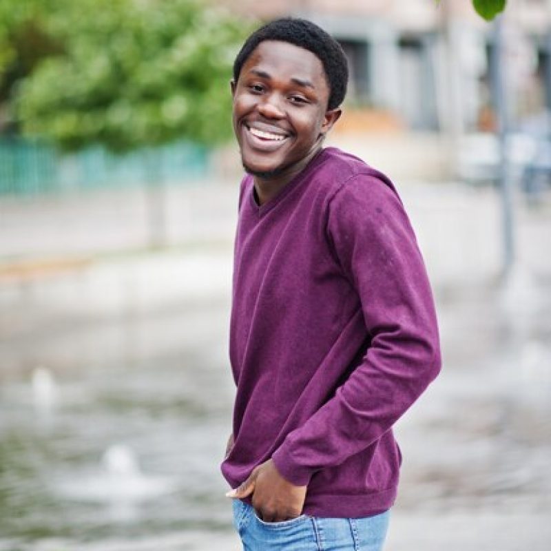 young-african-american-man-violet-jumper-posed-against-fountain-alley_627829-161